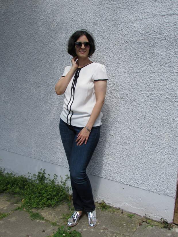 white top, blue jeans and metallic loafers white top, blue jeans and metallic loafers