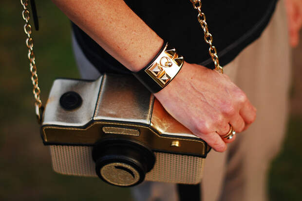 Camera cross body bag and gold cuff