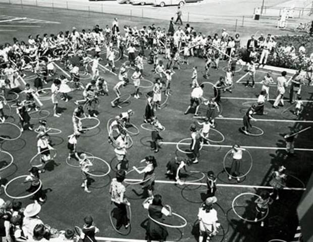 At the height of the hula hoop craze, various techniques are demonstrated in Los Angeles Aug. 20, 1958 as children ranging from 2 to 16 years old competed for prizes on "Art Linkletter's House Party" show.  Groups including the Girl Scouts, Brownies, Blue Birds and Campfire Girls were represented. (AP Photo)