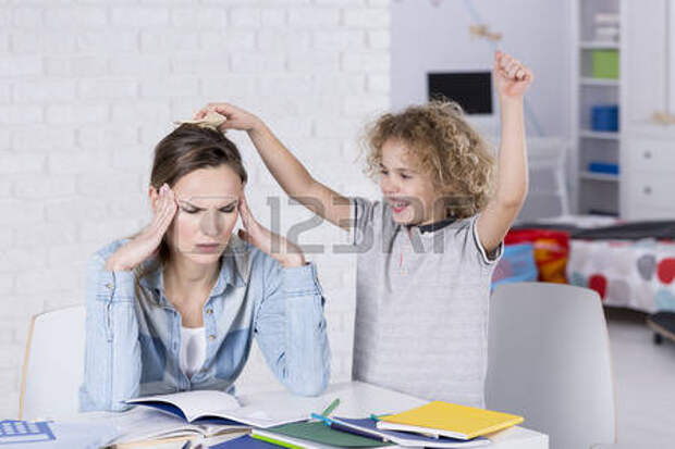 Child annoying his tired mother with headache