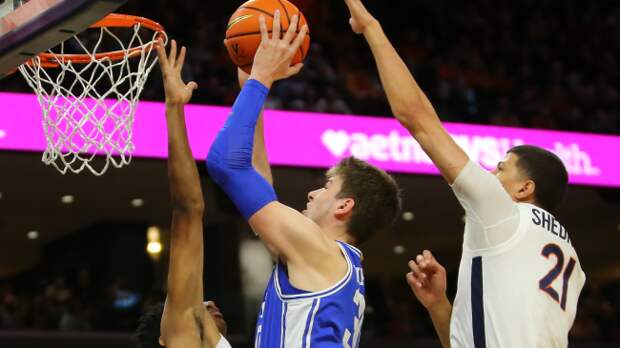 A Duke player attempts a shot.