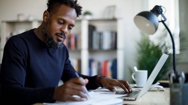 Person looking at documents in office.