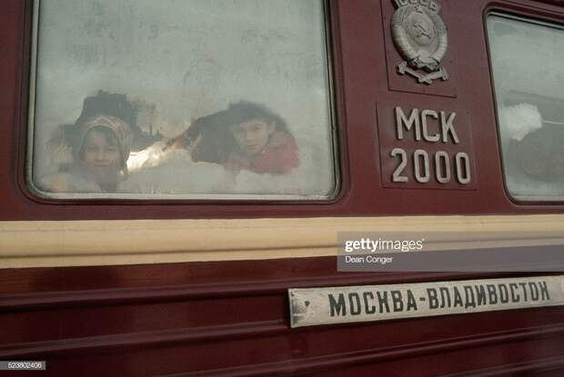 Children Peer Through the Frosted Window of a Trans-Siberian Railway Car : Stock Photo