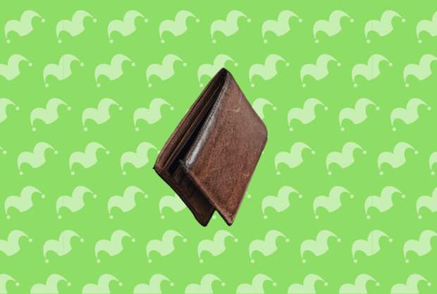 A wallet on top of a green background