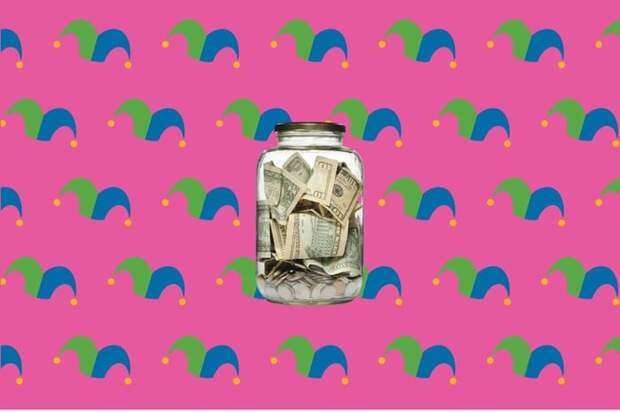 A glass jar full of bills and coins
