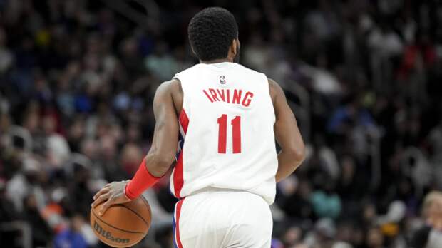 Kyrie Irving dribbles the basketball.
