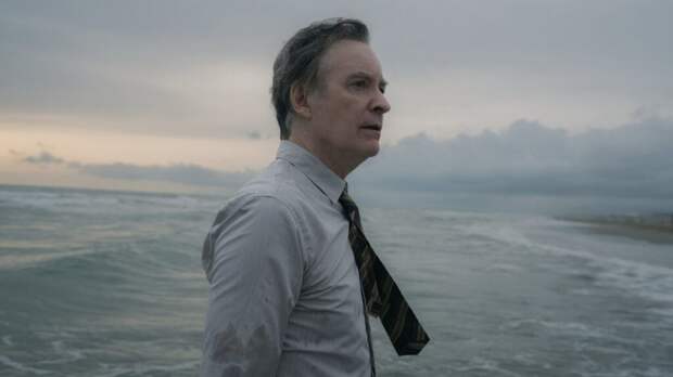 A young Stephen stands in the sea where his son drowned.