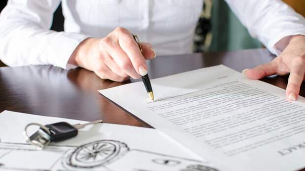 Woman reading a car purchase contract