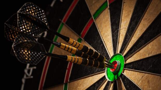 darts in bullseye dartboard