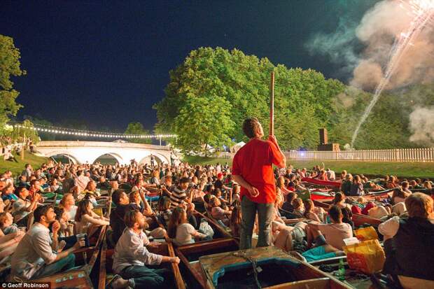 Guests look on as the sky is lit up during the lavish all-night parties attended by three separate Cambridge colleges