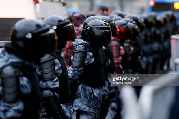 Police officers stand guard