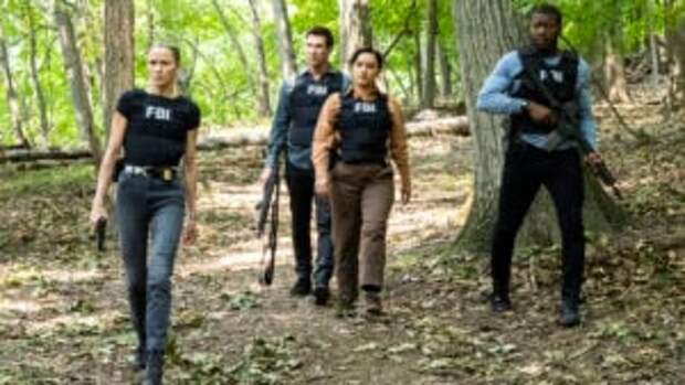 The FBI is armed as the agents walk through the woods to capture an ecoterrorist on FBI: Most Wanted Season 6 Episode 3