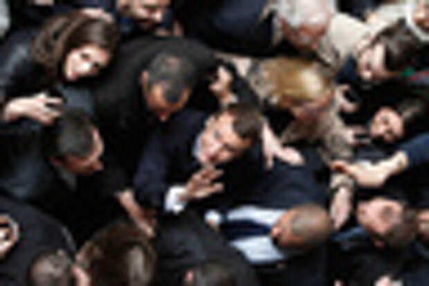 Former French Economy Minister and candidate for the next presidential election, Emmanuel Macron leaves the University of Lille, during a political rally for his movement, En Marche! (Forward!) in Lille, Tuesday, March 14, 2017.