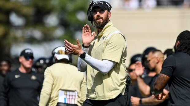Offensive coordinator Sean Lewis reacts to a play on the sidelines.
