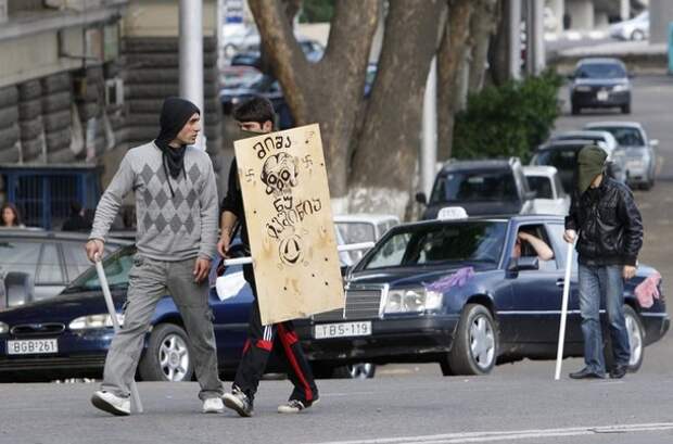 Opposition supporters arrive to take part in a rally in Tbilisi
