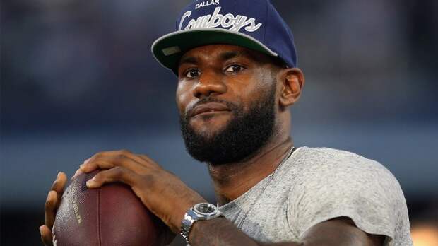 LeBron James holding a football