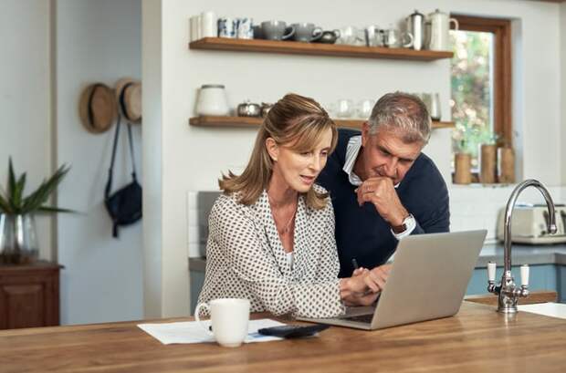 Two people at a laptop.