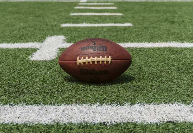 A football rests on the field.