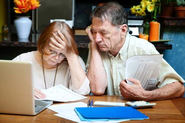 Two people looking at a document.