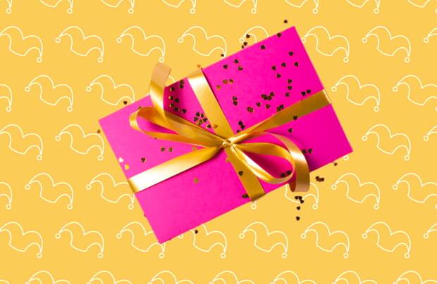 A box wrapped in pink with a gold bow