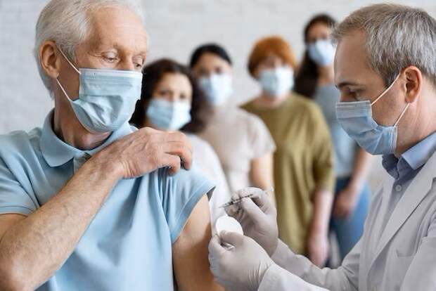 man-getting-vaccine-shot-by-doctor-with-medical-mask_23-2148988246.jpeg.jpg