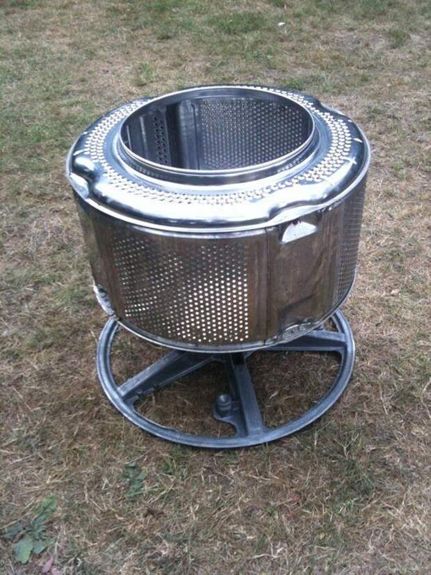 make a fire pit from an old washing machine drum and a bike wheel, easy! 