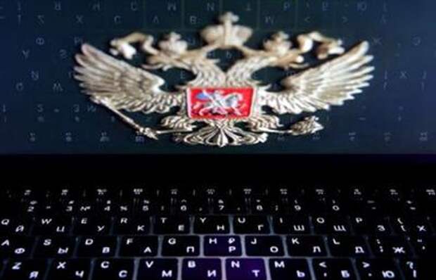 The coat of arms of Russia is reflected in a laptop screen in this picture illustration taken February 12, 2019. REUTERS/Maxim Shemetov
