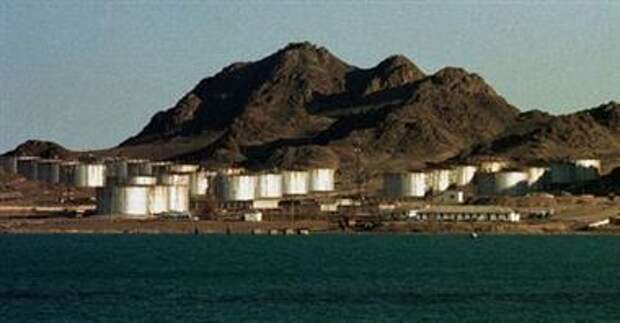 File general view of an oil tank farm on the Caspian coast near the town of Turkmenbashi in western Turkmenistan, March 10, 1999. The oil-rich Caspian is the scene of a new diplomatic and commercial "Great Game" involving Russia, the United States, Iran, China and a host of other countries. The new Game replicates a nineteenth century struggle for influence in the region, also known as the Great Game, between the world's then greatest powers, Britain and Russia. AS 