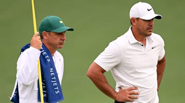 Brooks Koepka and caddie Ricky Elliott at The Masters