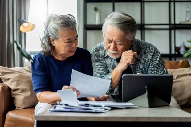 Two people looking at a document.