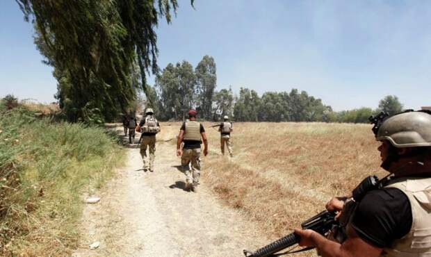 Иракские военные ведут бой за освобождение города Тикрит от ИГ