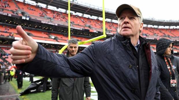 NFL commissioner Roger Goodell waves to fans