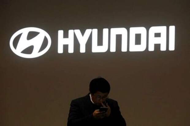 A man walks past the logo of Hyundai Motor during the 2019 Seoul Motor Show in Goyang, South Korea, March 28, 2019. REUTERS/Kim Hong-Ji