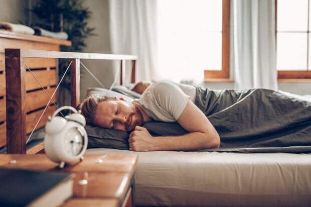 A man sleeping soundly in his bed.