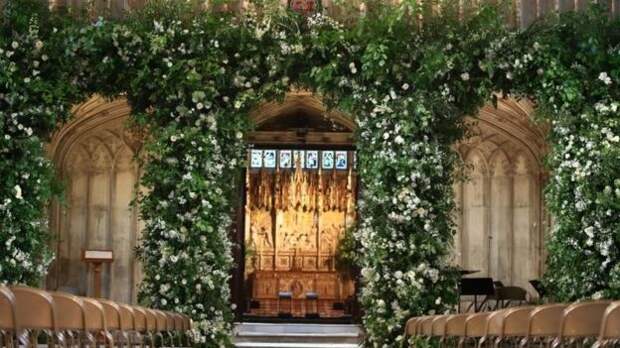 Flowers adorn the front of the organ loft inside St George