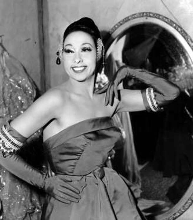 Singer Josephine Baker poses in her dressing room at the Strand Theater in New York City on March 6, 1961. Baker is co-starring with French orchestra leader and husband, Jo Bouillion. Her last appearance in New York was 1937 in "The Ziegfeld Follies." (AP Photo)