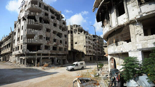 Разрушенные жилые дома в сирийском городе Хомс. Архивное фото