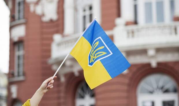 person-holding-ukrainian-flag