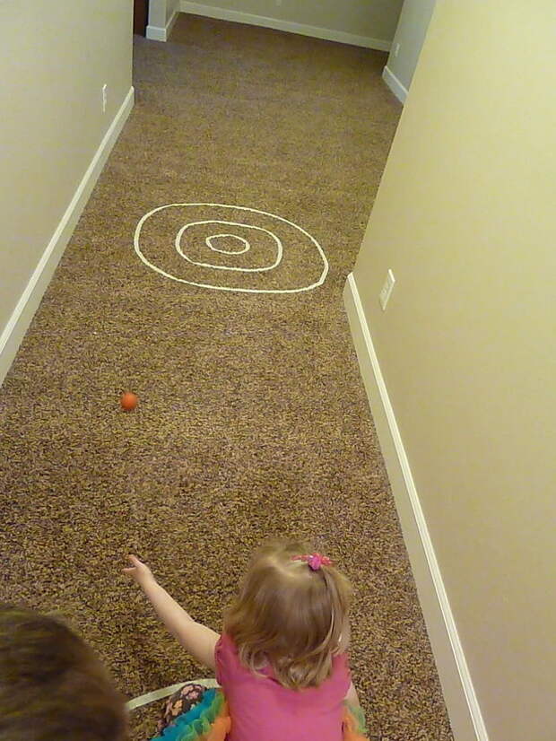 Put some tape on the carpet to play bullseye bowling.
