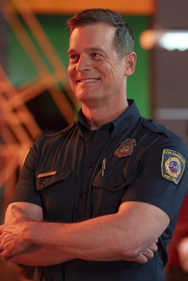 Bobby looks happy as he looks on during 9-1-1 Season 8 Episode 4.