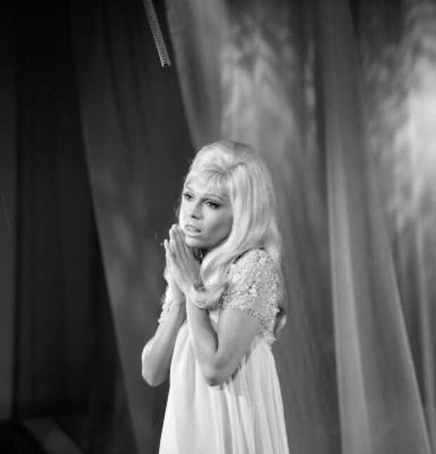 American popular singer Nancy Sinatra sings with her hands together before her during an appearance on the Ed Sullivan Show, New York, October 1, 1967.