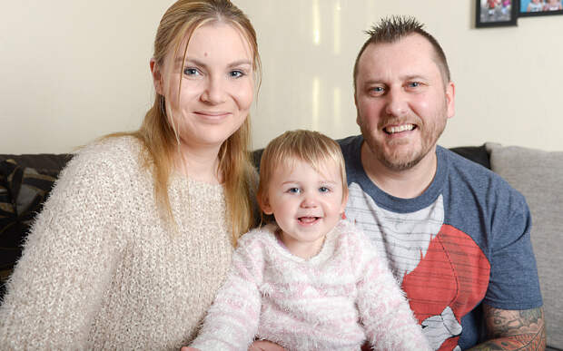Bella Moore-Williams, pictured at home in Clacton-on-Sea, Essex, with parents Francesca & Lee.y.