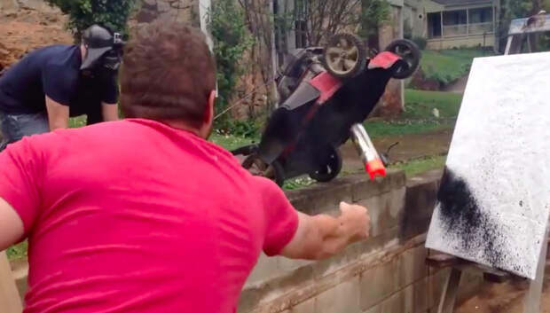 Bro Finds Out What Happens When You Throw A Can Of Spray Paint In A Lawn Mower