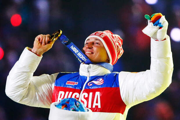 Russian gold medalist Alexander Legkov celebrates as he recieves his medal for the men's cross-country 50-kilometer mass start race during the closing ceremony for the Sochi 2014 Winter Olympics, February 23, 2014.