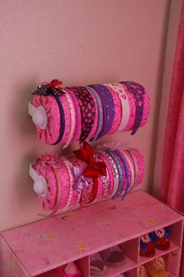 Headband Storage - paper towel holder with paper towels covered with fabric.  Yes, paper towels.: 