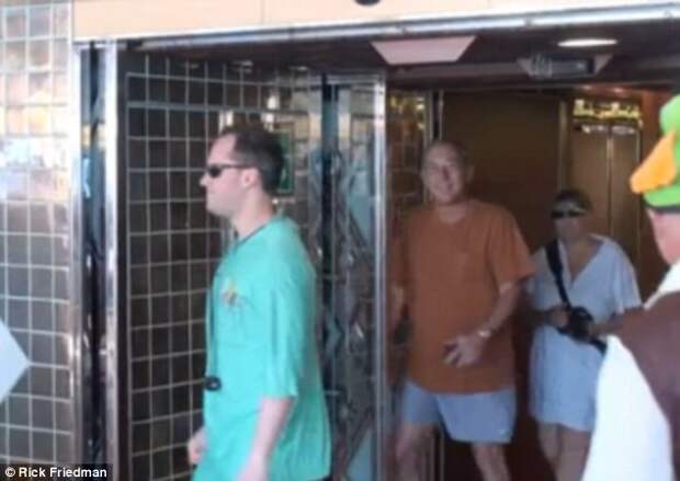 Unexpected strike: James Hausman, 61, is captured on surveillance video being hit by a sliding-glass door as Holland America's Pacific fleet flagship, the M/S Amsterdam, approaches Hawaii on November 26, 2011
