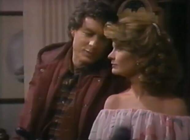 1982 screenshot of Roman (then played by Wayne Northrop) and Marlena at a party on Days of Our Lives