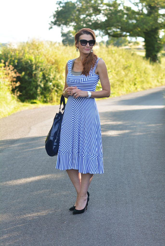 Blue and white striped midi dress, black heels, black belt