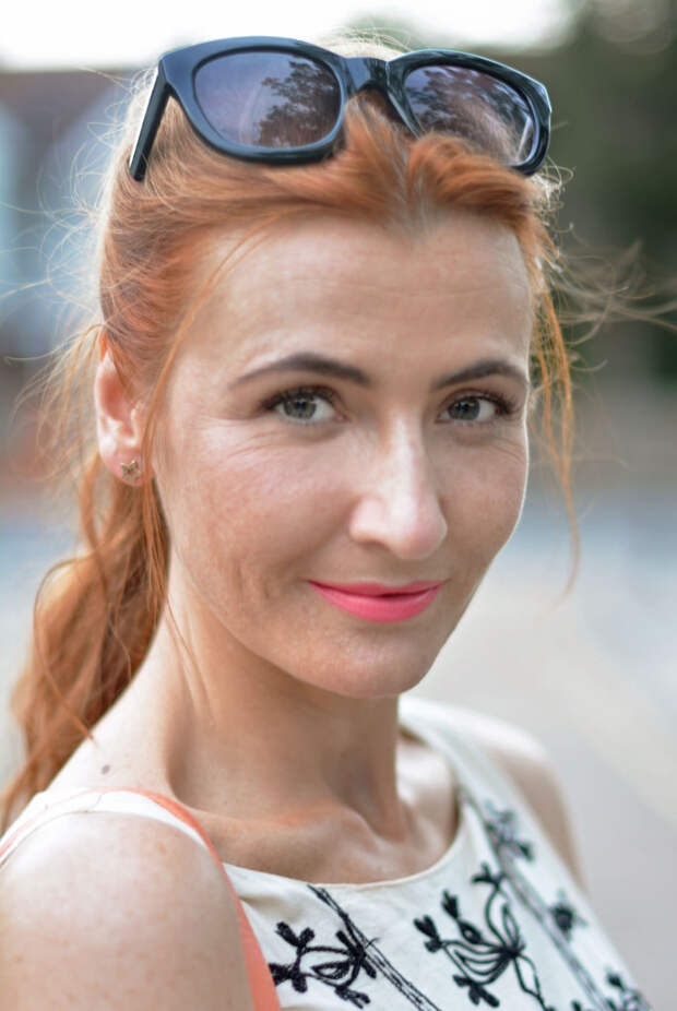 Cream embroidered summer dress, bright coral lips, red hair