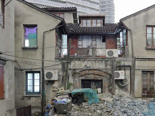 Трущобы упрямых китайцев, отказывающихся переселяться в квартиры (23 фото)